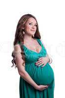 Lovely pregnant woman touching belly