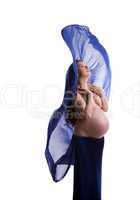 Topless pregnant woman posing with blue cloth