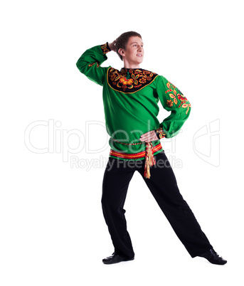 Cheerful man performing folk dance in studio