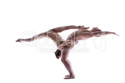 Attractive young gymnasts show acrobatics