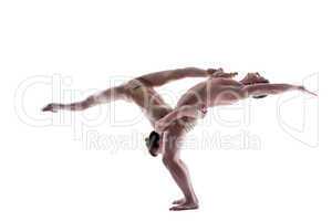Attractive young gymnasts show acrobatics