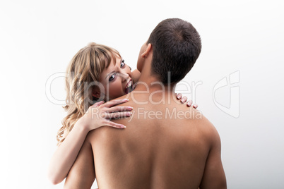 Image of playful brunette biting man