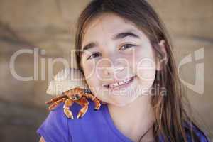 Young Girl Playing with Toy Hermit Crab