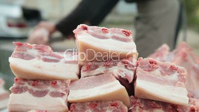 Selling pork meat at street market