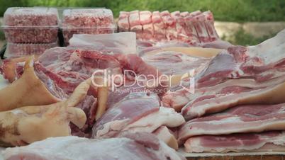Selling pork meat at street market
