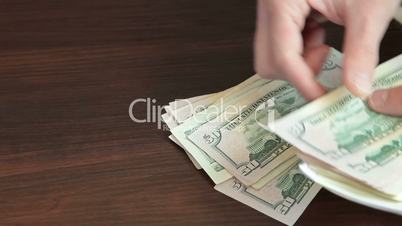 Male Hands Counting US Dollars and Euro