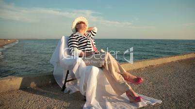 Senior woman enjoying vacation tour at the seaside