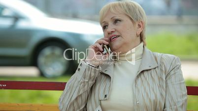 Active Senior Lady On The Phone Outdoors