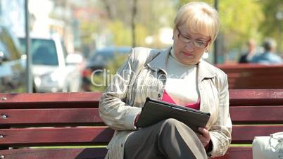 Senior Woman Using Digital Tablet