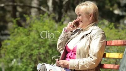Smiling Senior Woman On The Phone
