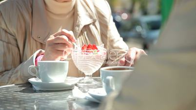 Senior Women Enjoying Dessert At Outdoor Cafe