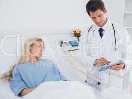 Doctor showing digital tablet