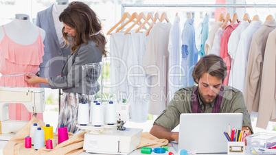 Fashion designers working in a bright office