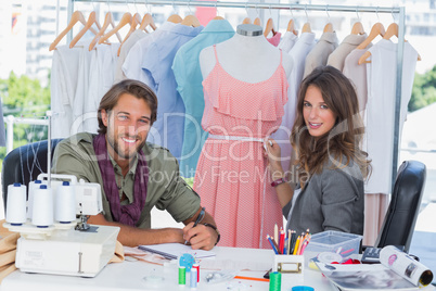 Fashion designers smiling to the camera