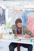Fashion designer drawing clothes
