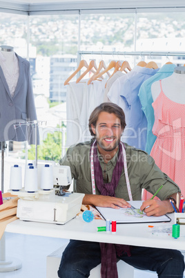 Handsome fashion designer smiling to the camera