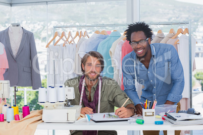 Attractive fashion designers working together