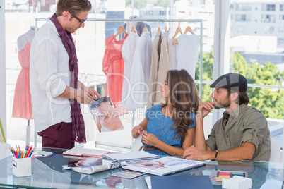 Attractive designer showing a picture
