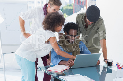 Creative designers using laptop