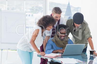 Attractive designers working in office at desk