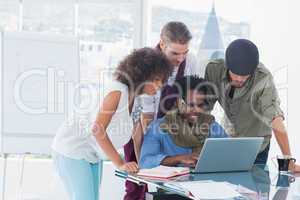 Attractive designers working in office at desk