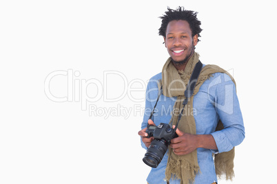 Attractive photographer holding camera