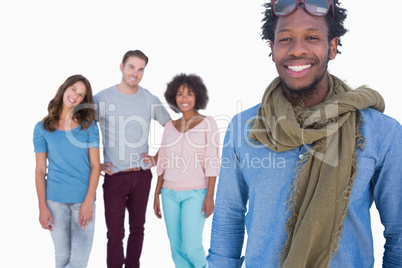 Fashion man standing in front of others young people