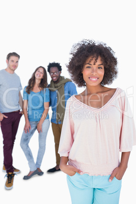 Stylish woman gesturing in front of a group of fashion people