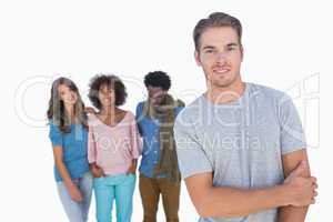 Handsome man gesturing in front of group of people