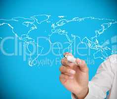 Businessman drawing world map