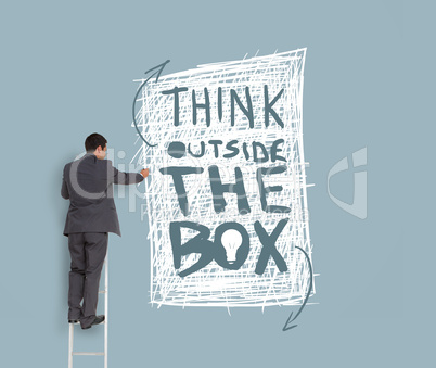 Businessman drawing think outside the box message