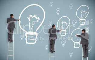 Multiple businessmen on ladders drawing light bulbs