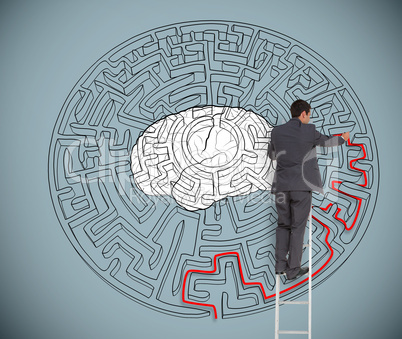 Businessman trying to solve a large maze with a brain illustrati