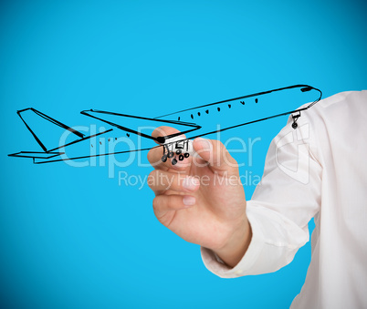 Businessman drawing black airplane