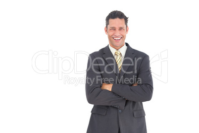 Laughing businessman with crossed arms