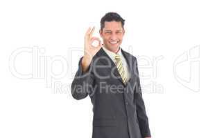 Smiling businessman saying ok