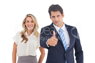 Businessman with thumb up and his smiling coworker