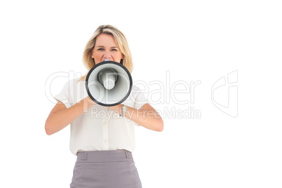 Businesswoman shouting through megaphone