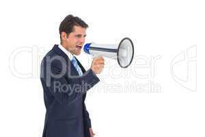 Businessman shouting with a megaphone