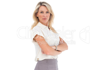 Serious businesswoman standing with arms crossed Serious businesswoman standing with arms crossed