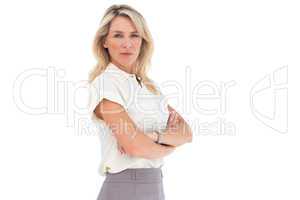 Serious businesswoman standing with arms crossed