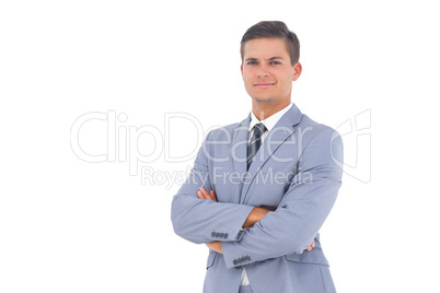 Smart businessman with arms crossed