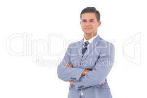 Smart businessman with arms crossed