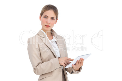 Businesswoman pointing something on her digital tablet