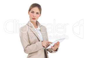 Businesswoman pointing something on her digital tablet