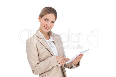 Smiling businesswoman using a digital tablet