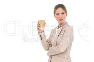 Serious businesswoman with coffee cup