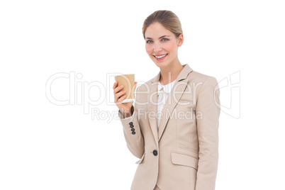 Smiling businesswoman holding a coffee cup