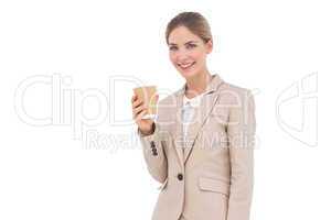 Smiling businesswoman holding a coffee cup