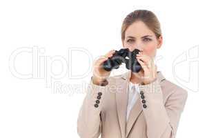 Businesswoman with binoculars